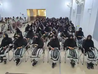 Students seated together during a school programme